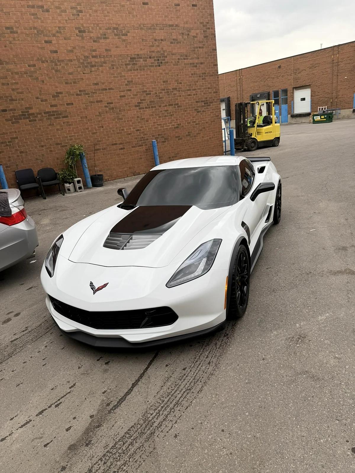 White Chevrolet Corvette detailed outside the Mississauga studio