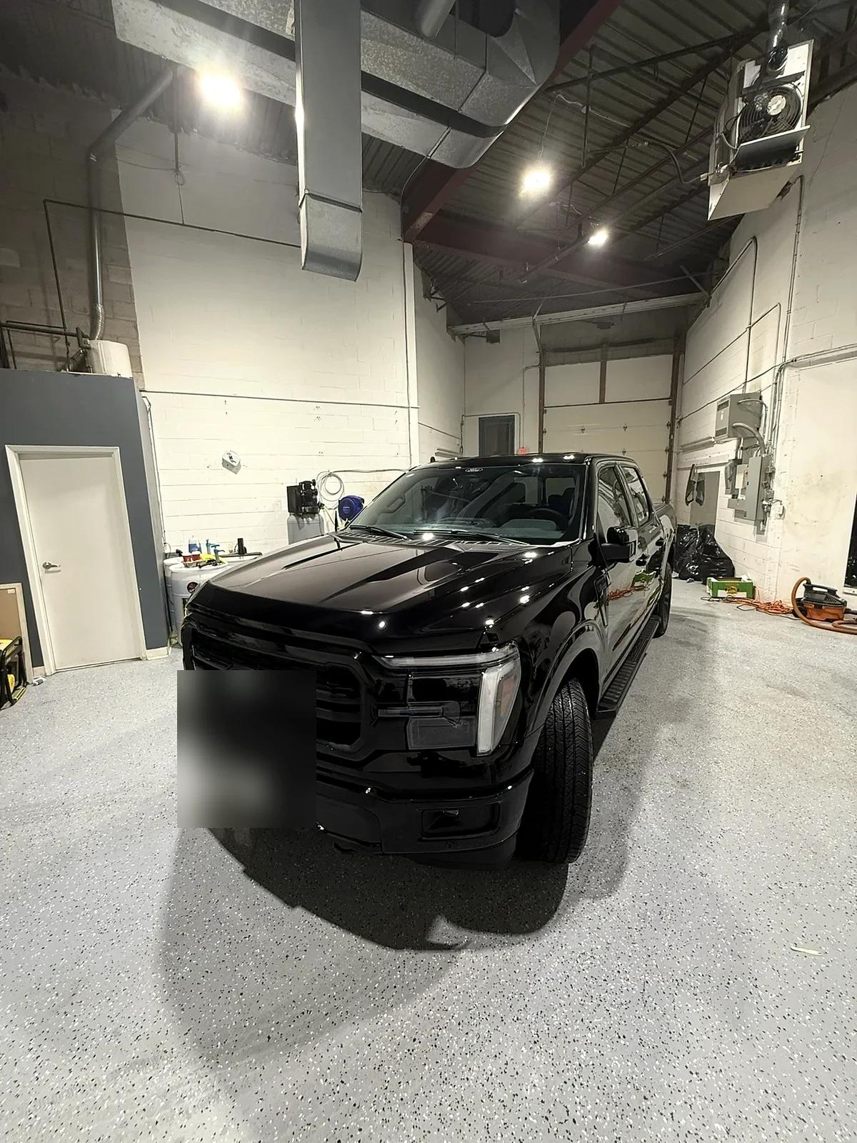 Black Ford F-150 detailed in the Cosmo Car Customs studio