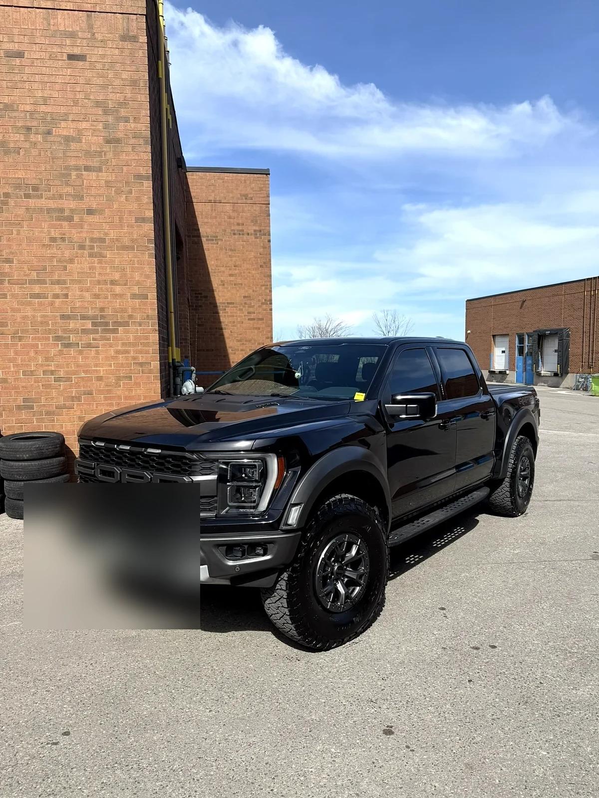 Black Ford F-150 Raptor after detailing and protection at Cosmo Car Customs