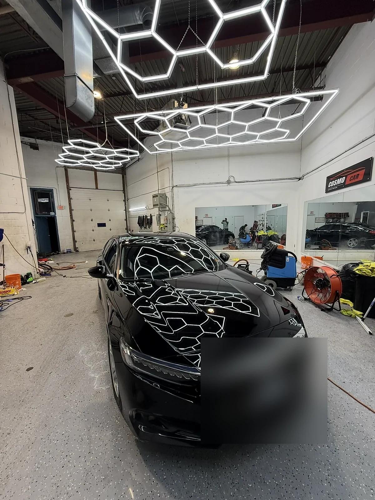 Black Honda Accord reflecting the studio hex lights after paint correction and ceramic coating
