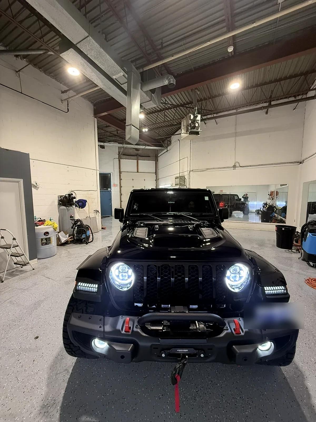 Black Jeep Wrangler with LED light bars detailed at Cosmo Car Customs