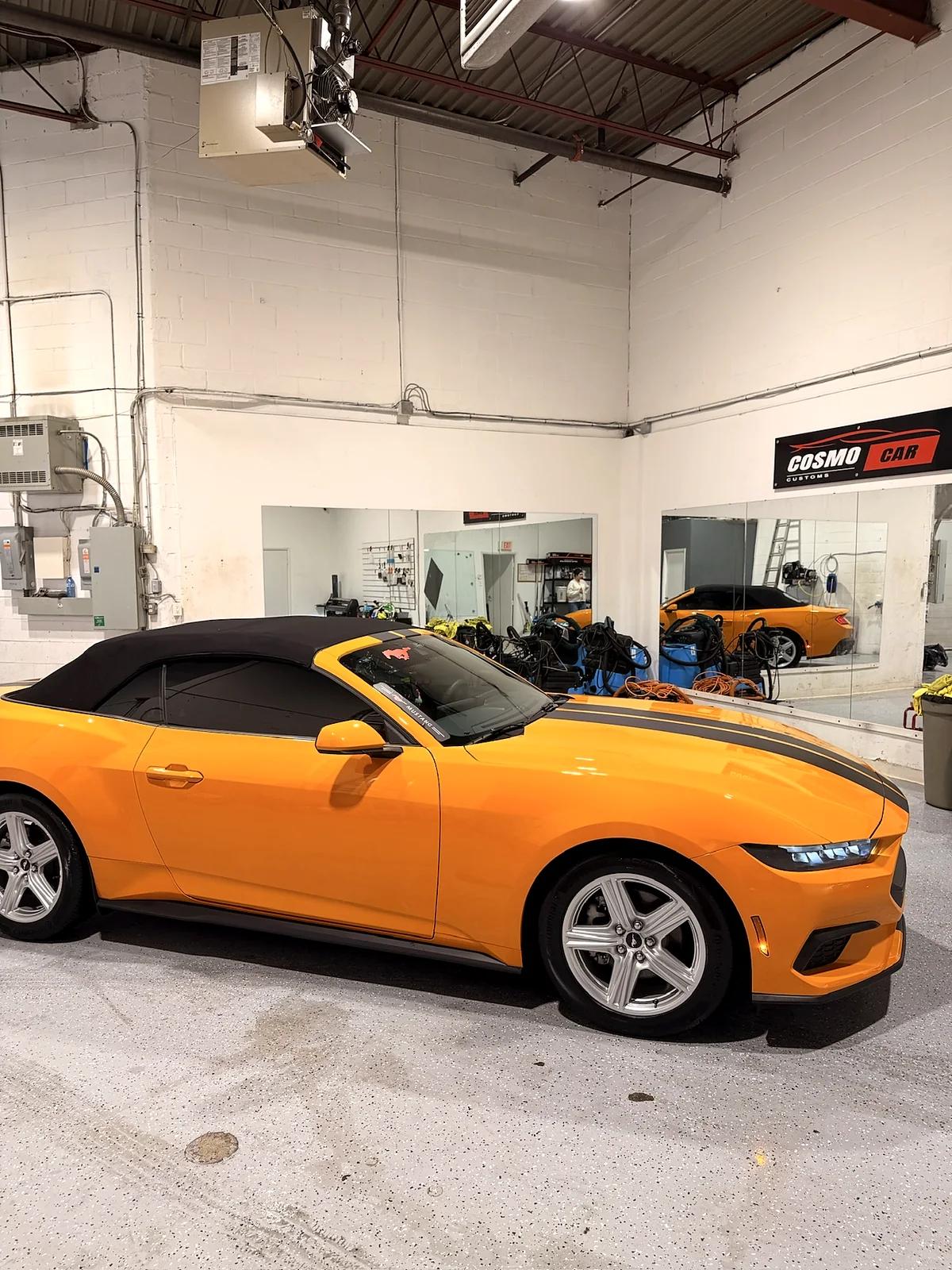 Orange Ford Mustang convertible detailed at the Cosmo Car Customs studio