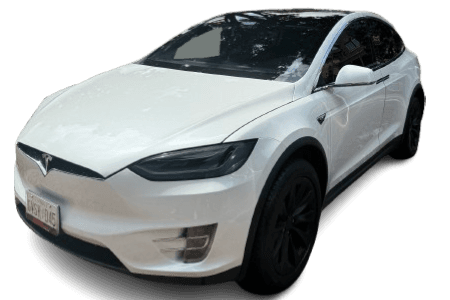 Clean, detailed white Tesla Model X after service at Cosmo Car Customs