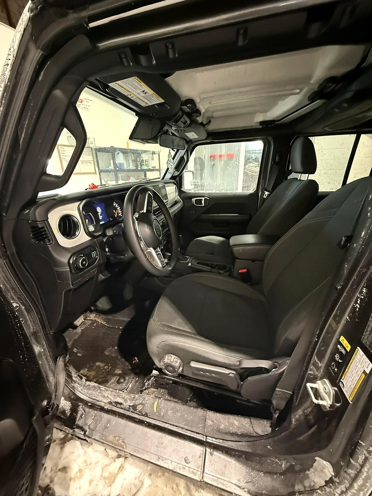 Jeep Wrangler sill and floor covered in salt and mud before detailing