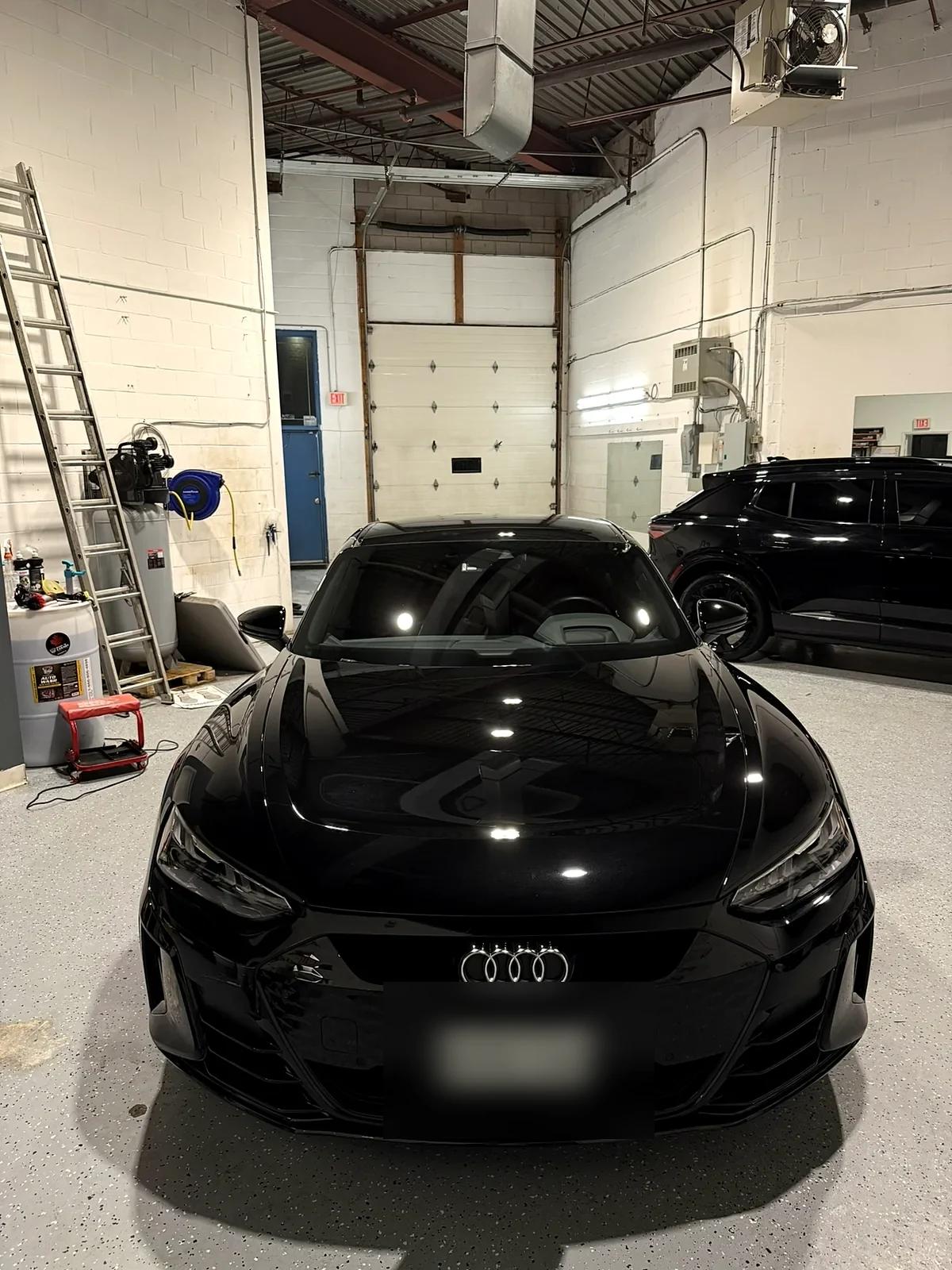 Black Audi e-tron GT after ceramic coating in the Cosmo Car Customs studio