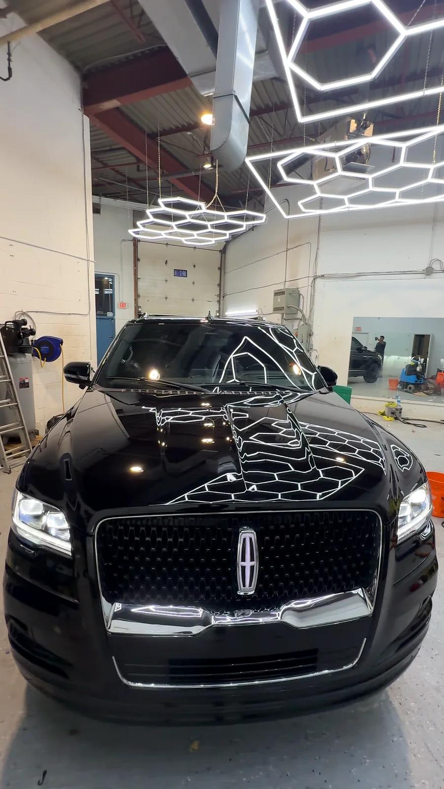 Black Lincoln Navigator with a mirror finish after ceramic coating
