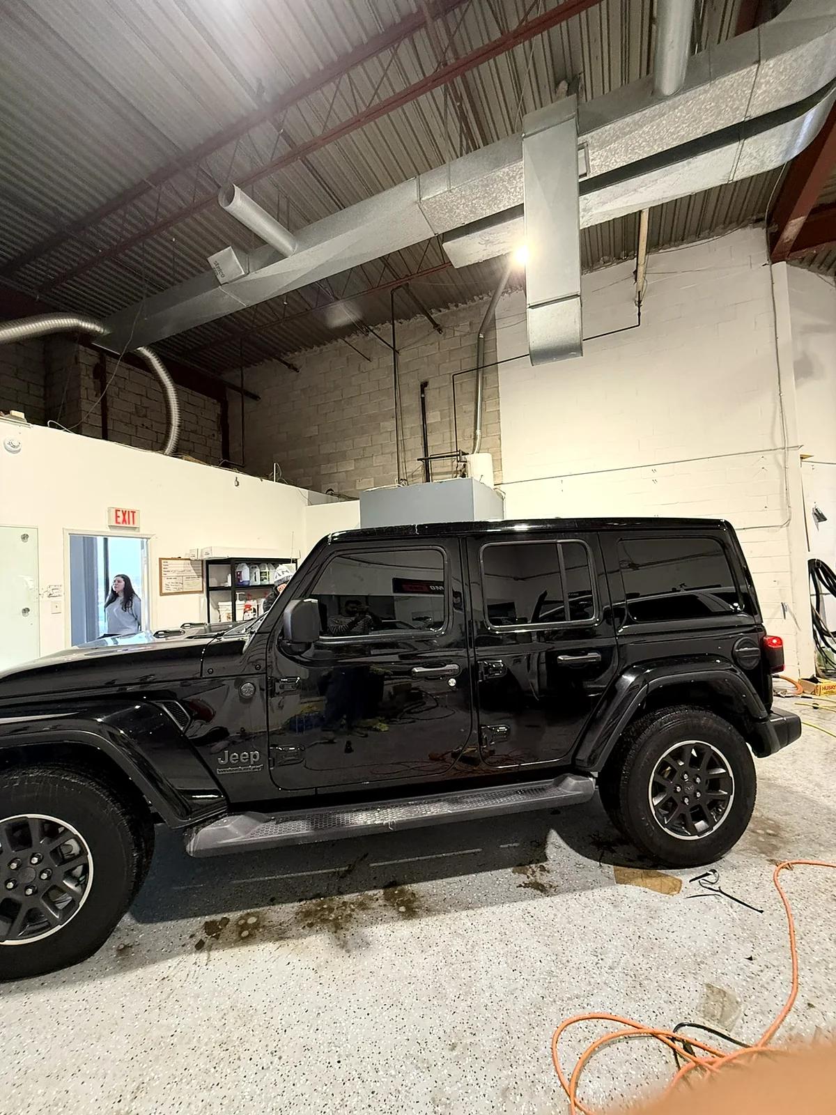 Black Jeep Wrangler with freshly tinted windows in the studio