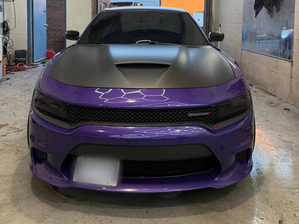 Purple Dodge Charger with gloss paint and a matte black hood in the Cosmo Car Customs studio