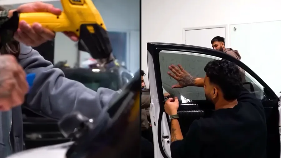 Cosmo Car Customs installers heat-shaping window film with a heat gun and fitting film to a car door window
